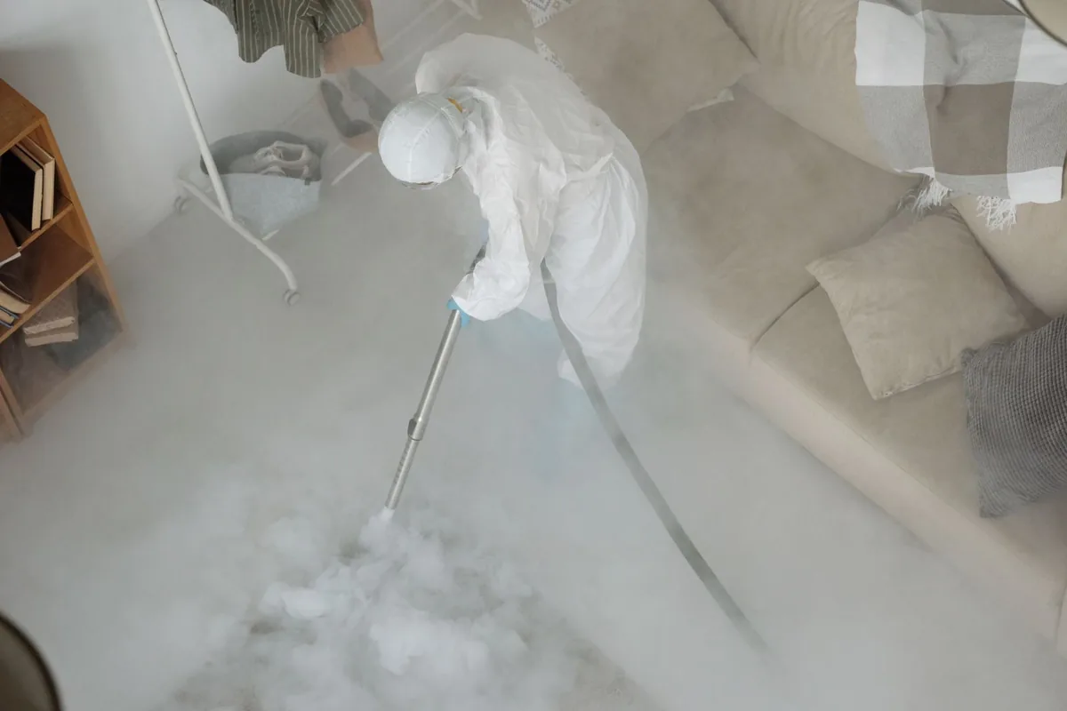 Biohazard cleanup technician in protective equipment, Ontonagon, MI